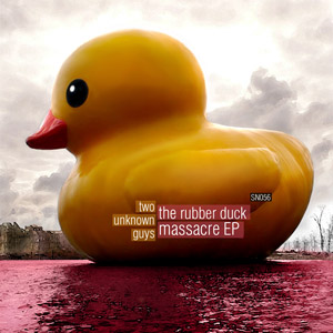 A monumental yellow rubber duck beside the water
